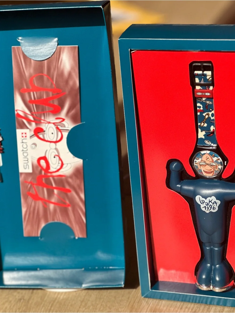 Swatch Club watch with display case and brooch